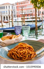 Pasta Spaghetti Bolognese In Venice, Italy At Outside Terrace Restaurant On The Grand Canal. Tradidional Italian Food.