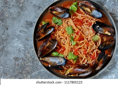 Pasta Spaghetti With Mussels, Tomato Sauce. Sea Food Meal. Mussels Marinara. Typical Dish Of Italian Pasta.  Top View.