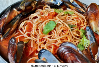 Pasta Spaghetti With Mussels, Tomato Sauce. Sea Food Meal. Mussels Marinara. Typical Dish Of Italian Pasta.