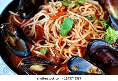 Pasta Spaghetti With Mussels, Tomato Sauce. Sea Food Meal. Mussels Marinara. Typical Dish Of Italian Pasta.