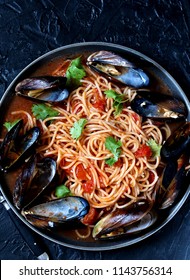 Pasta Spaghetti With Mussels, Tomato Sauce. Sea Food Meal. Mussels Marinara. Typical Dish Of Italian Pasta.  Top View.