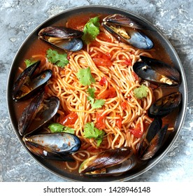 Pasta Spaghetti With Mussels, Tomato Sauce. Sea Food Meal. Mussels Marinara. Typical Dish Of Italian Pasta.  Top View.