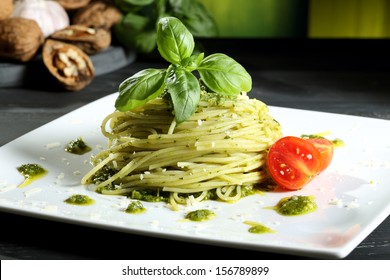pasta spaghetti with pesto  genovese green background - Shutterstock ID 156789899