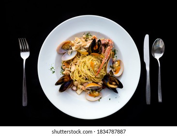 Pasta spaghetti seafood with mussels and shrimps and tomatoes, with parsley