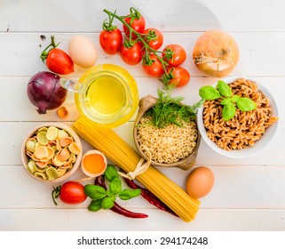 pasta and spices on a white wooden background - Shutterstock ID 294174248