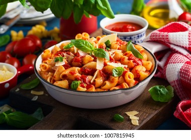 Pasta with spicy tomato sauce, parmesan and basil. Pasta Chifferi Rigati. - Shutterstock ID 1007815945
