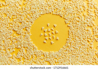 Pasta Text Of Macaroni Letters In A Round Macaroni Frame On A Yellow Background