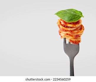 Pasta with tomato sauce on a fork
