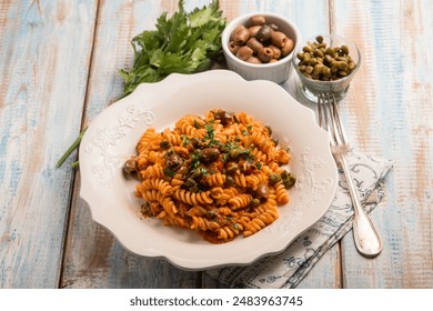 pasta with tuna tomatoes capers and black olives - Powered by Shutterstock