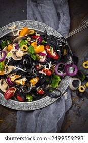 Pasta with vegetables on a rustic table