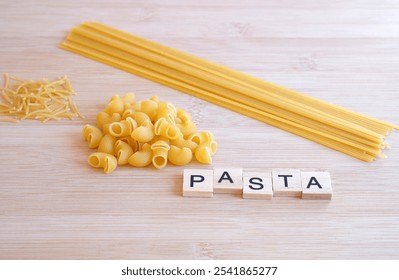 pasta. word pasta in wooden letters with spaghetti, noodles and macaroni - Powered by Shutterstock