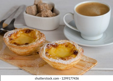 Pasteis de Belem -  portuguese egg tart pastries coffee at Lisbon cafe, Portugal. This weets making to according to the Jeronimos Monastery secret recipe.