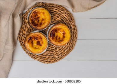 Pasteis De Nata, Typical Portuguese Egg Tart Pastries On A Set Table. Top View With Copy Space