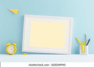 Pastel Blue Desk, Table Of Young Student With Empty Photo Or Poster Frame, Yellow Supples, Books And Flying Paper Plane. Back To School Cute Mock Up Arrangement.