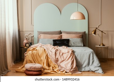 Pastel Blue, Pink And Orange Bedding On Double Bed In Chic Bedroom Interior