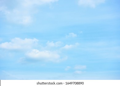 Pastel blue sky with clouds - abstract background