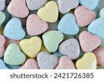 Pastel candy conversation hearts background for Valentine