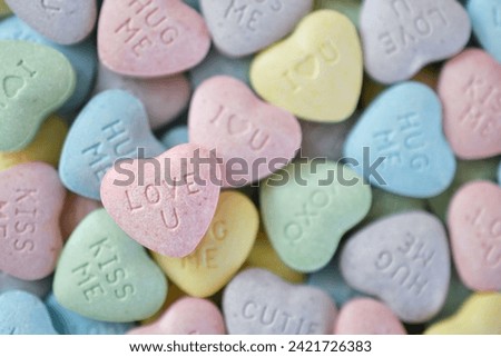Pastel candy conversation hearts background for Valentine's Day - love u, kiss, hug, XOXO, cutie
