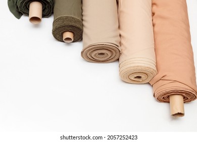 pastel color fabric rolls isolated on white, Synthetic and natural fabrics with copyspace. - Shutterstock ID 2057252423