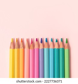 Pastel color pencils on pink background - Powered by Shutterstock