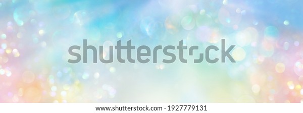 Pastel colored banner of abstract sparkling lights
in a cosmic field of  pure energy with plenty of copy space for
individual text and
design