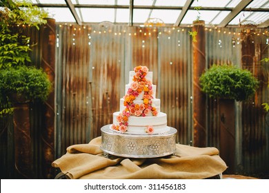 Pastel Colored Flower Petals Decorating Layered Wedding Cake