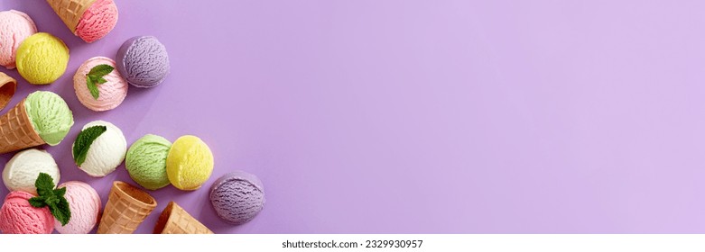 Pastel colored ice cream scoops and cones border on pastel violet background
