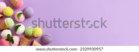 Pastel colored ice cream scoops and cones border on pastel violet background