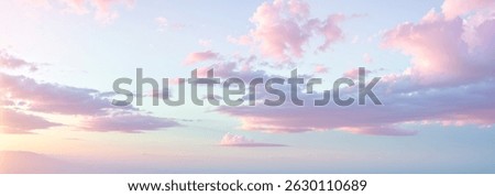 Pastel colored sky with soft clouds in shades of pink blue and white.