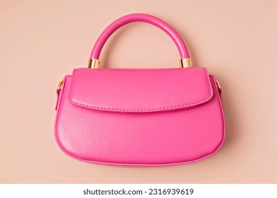 Pastel colored womens hand bag on pink background. Summer fashion concept. Mockup - Shutterstock ID 2316939619