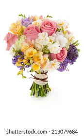 Pastel colors wedding bouquet made of Roses, Freesia, Carnation and Limonium flowers isolated on white.