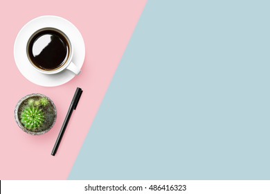 Pastel Desk Table With Coffee And Pen. Top View With Copy Space, Flat Lay.