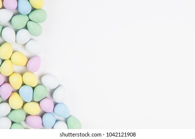 pastel easter eggs on a white background with lots of copy space