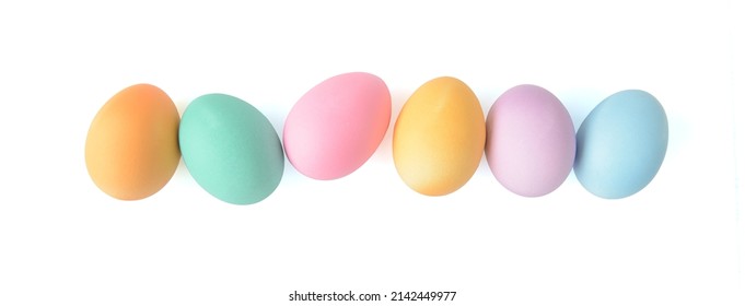 Pastel Easter eggs in a row isolated on white background, top view - Shutterstock ID 2142449977