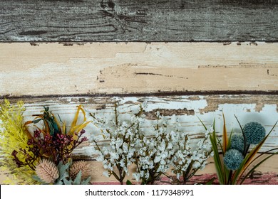 Pastel floral arrangement of baby's breath and other floral elements. Placed on a rustic wooden background. Useful for spring and fall concepts - Shutterstock ID 1179348991