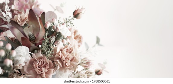 Pastel floral composition made of beautiful flowers and berries on light backdrop. Floristic decoration. Natural floral background. - Shutterstock ID 1788508061