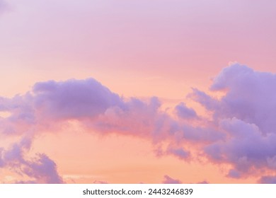 Pastel nature Sunset, purple fluffy clouds on pink peach colored sky, picturesque landscape pastel tones, soft colorful scenery with vanilla sky, beautiful sunlight lighting heaven in bright colors - Powered by Shutterstock