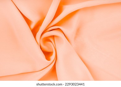 Pastel orange color cloth waves background texture.  Foto stock