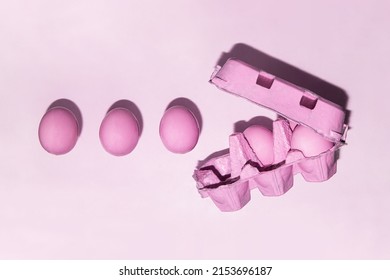 Pastel Pink Eggs In Carton On Light Background. Creative Monochromatic Food Concept. Minimalistic Easter Composition.