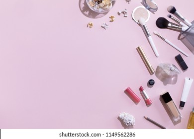 Pastel Pink Office Table Desk With Beauty And Make Up Accessories, Cosmetics Set, Top View And Flat Lay. Home Fashion Women Office Workspace Isolated On Pink Background.