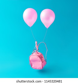 Pastel pink school bag with balloons floating against sky blue background. Surreal modern still life. Back to school minimal concept. - Powered by Shutterstock