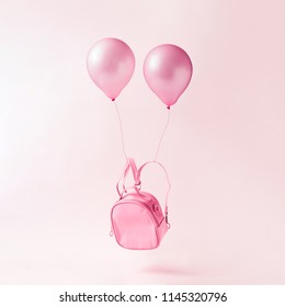 Pastel pink school bag with balloons floating. Surreal modern still life. Back to school minimal concept. - Powered by Shutterstock