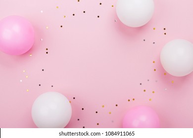 Pastel Pink Table With Balloons And Confetti For Birthday Top View. Flat Lay Composition.