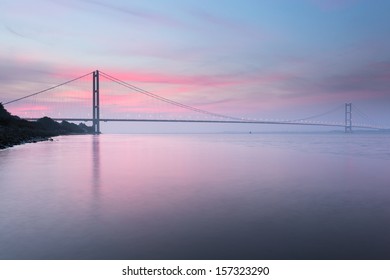 Pastel red sunrise over the Humber Bridge (UK)
