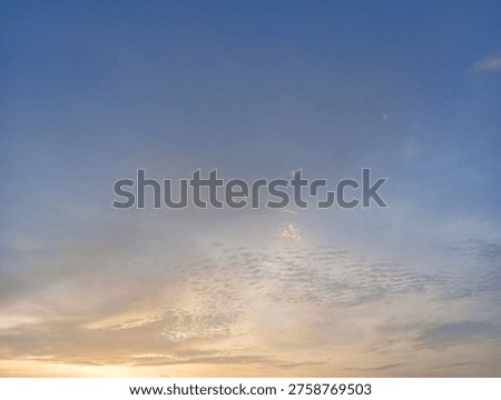 Pastel Sunset Sky With Soft Clouds and Warm Horizon at Dusk