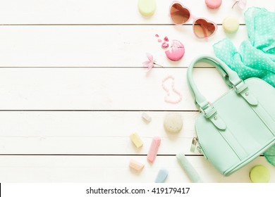 Pastel Theme Mood Board With Fashion Accessories (bag, Sunglasses, Scarf) For Girls. White Rustic Wooden Background. Flat Lay Composition (from Above, Top View). Free Text Space.