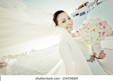 Pastel Tone Of Young Asian Bride Having Her Wedding Party On Small Cruise