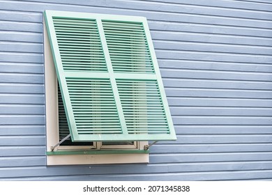 Pastel Turquoise Blue Purple Painted Colorful Hurricane Open Window Shutters Closeup Architecture Exterior Of House In Seaside, Florida Beach Home Cottage