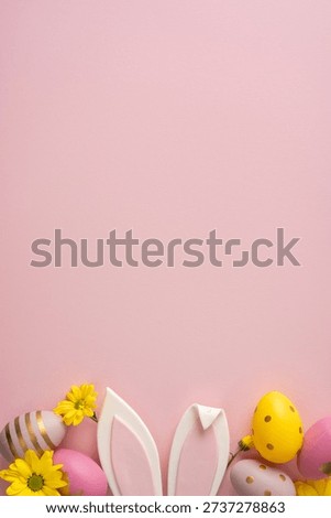Pastel vertical Easter eggs, bunny ears, and yellow flowers rest on a pink backdrop, creating a cheerful Easter greeting scene perfect for seasonal campaigns and cards