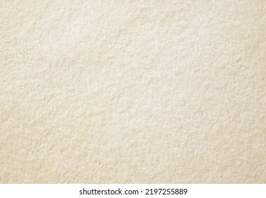 Pastel yellow towel blanket texture background. Soft and fluffy fabrics.